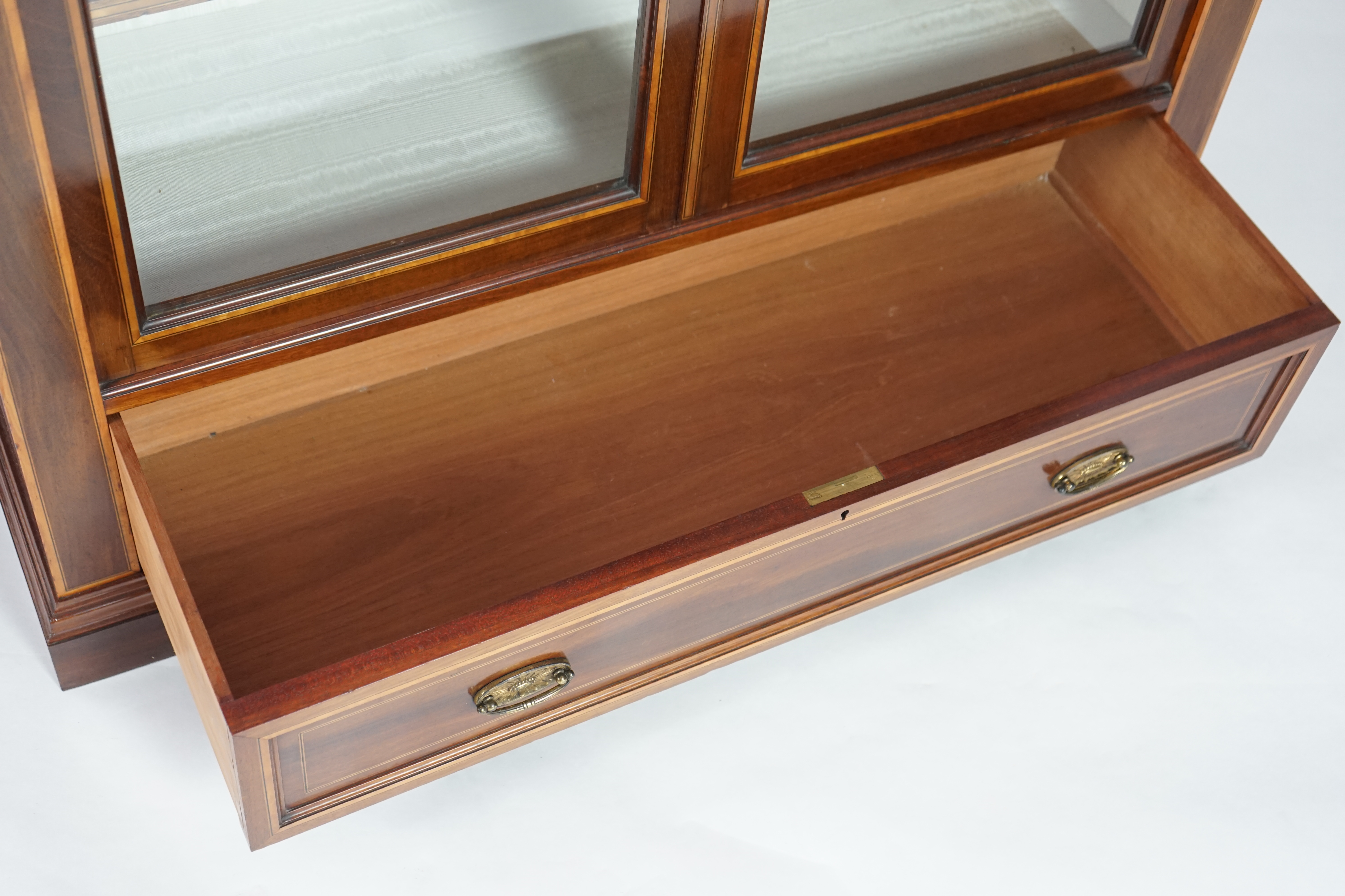 A pair of Edwardian marquetry inlaid and satinwood banded mahogany side cabinets, by Gillows